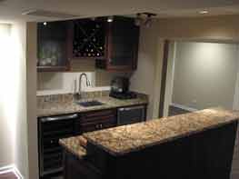 New bar designed and installed in Aurora basement Basement bar with sink and wine rack