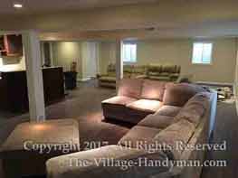 Large basement remodeled in Aurora Wide view of finished basement with built-in bar